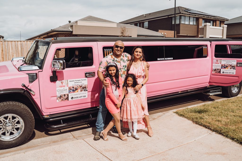 birthday girl and family by pink hummer limo