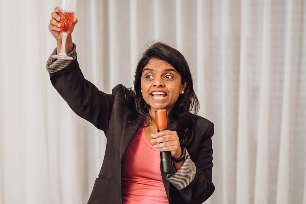 party host raise glass for toast cheers