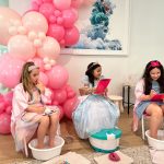 3 girls including the celebrant having a foot spa