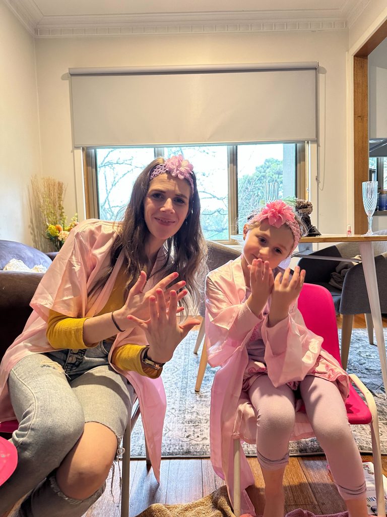mum and daughter show nails
