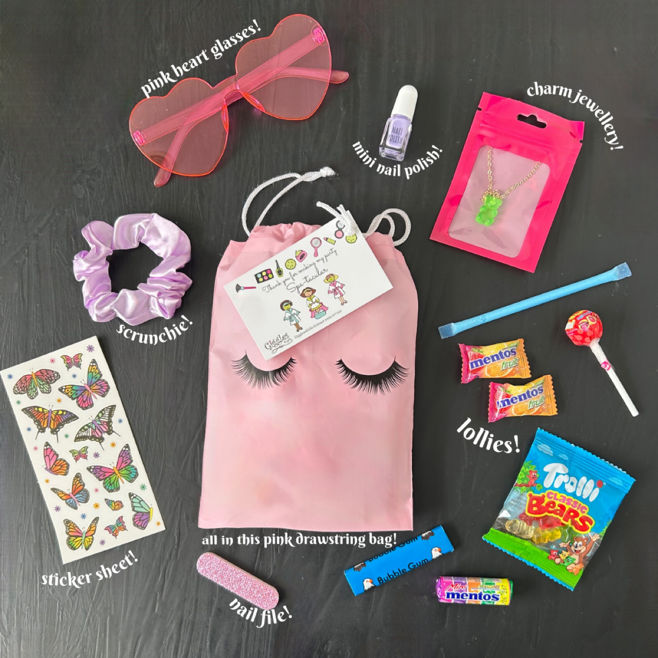 Party bag includes pink heart glasses, mini nail polish, charm jewelry, scrunchie, candies, sticker sheet, nail file